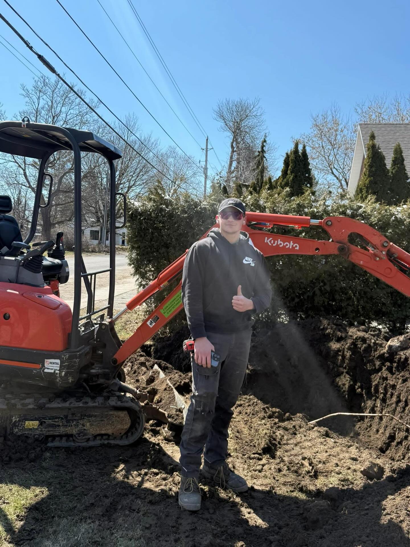 Mini excavator on job site